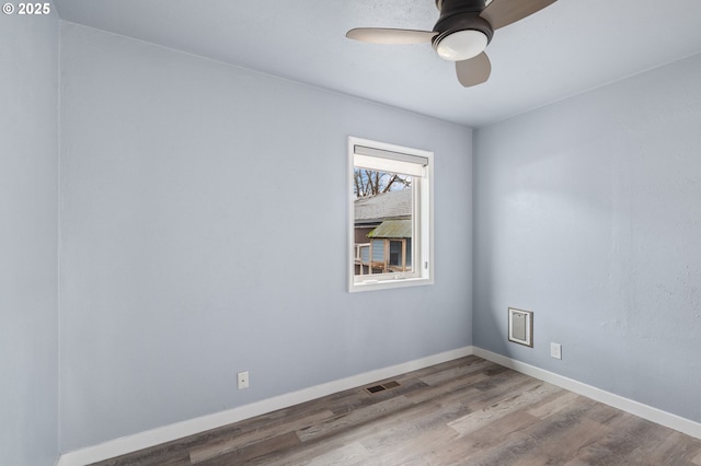 unfurnished room featuring hardwood / wood-style floors and ceiling fan