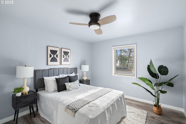 bedroom with dark wood-type flooring and ceiling fan