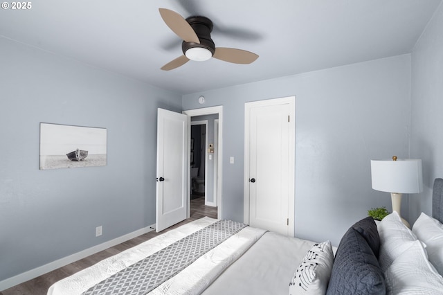 bedroom featuring hardwood / wood-style flooring and ceiling fan