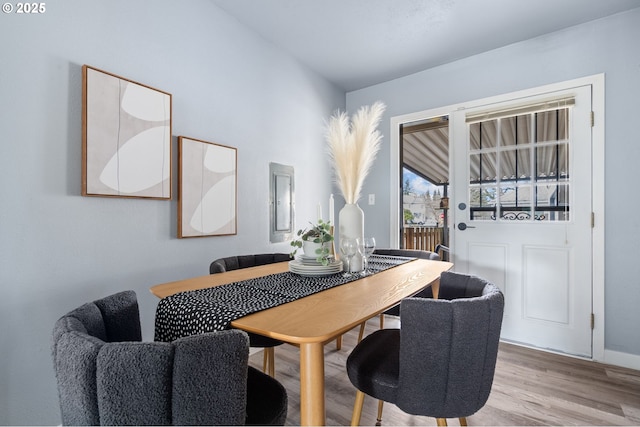 dining area with wood-type flooring