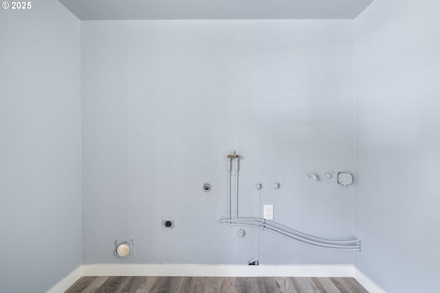 laundry room featuring washer hookup, hookup for an electric dryer, hookup for a gas dryer, and wood-type flooring