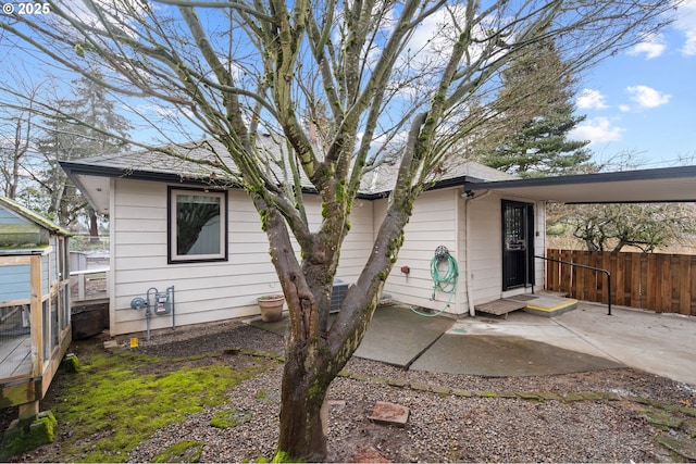 rear view of house with a patio