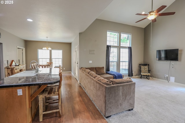 356 Wild Fern Dr, Winchester, OR 97495 - living room featuring plenty of natural light, baseboards, a chandelier, a ceiling fan, and high vaulted ceiling