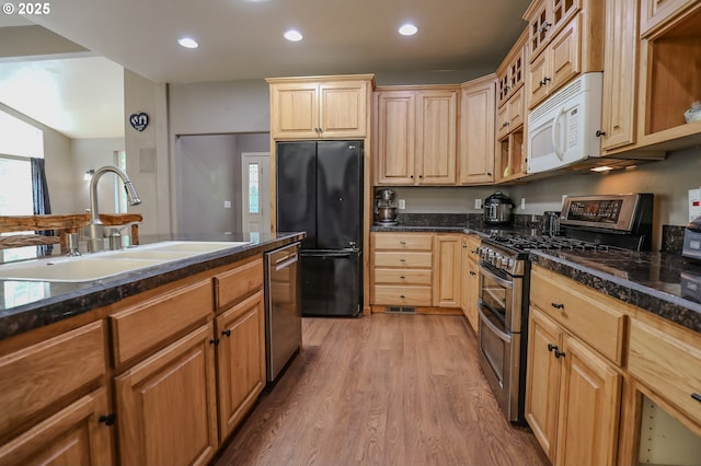 356 Wild Fern Dr, Winchester, OR 97495 - kitchen with appliances with stainless steel finishes, a sink, light wood-style flooring, recessed lighting, and glass insert cabinets