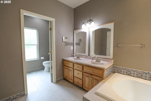 356 Wild Fern Dr, Winchester, OR 97495 - full bath featuring toilet, double vanity, a bath, baseboards, and tile patterned flooring