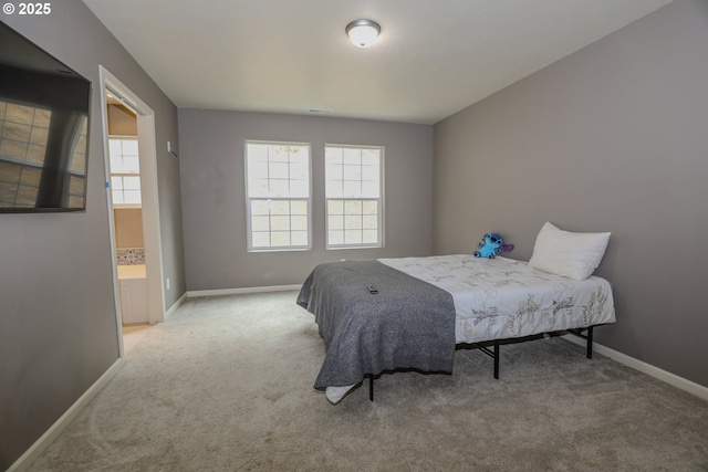 bedroom featuring carpet flooring and baseboards