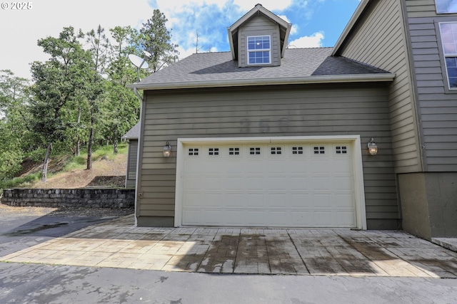 garage featuring driveway