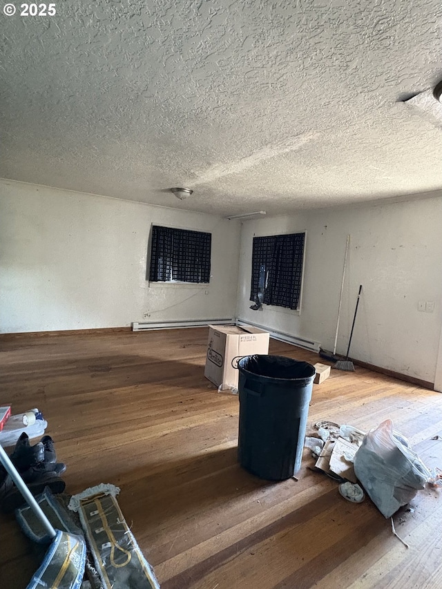 living room featuring a textured ceiling and hardwood / wood-style flooring