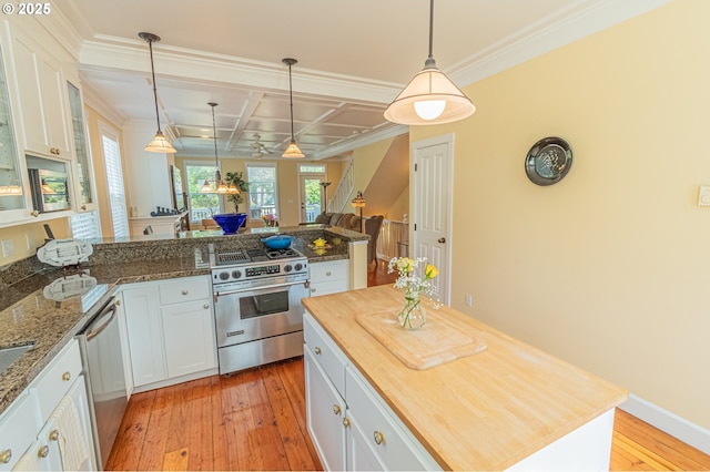 319 Kinnikinnick Way, Depoe Bay, OR 97341 - kitchen featuring stainless steel appliances, butcher block counters, white cabinetry, open floor plan, and coffered ceiling