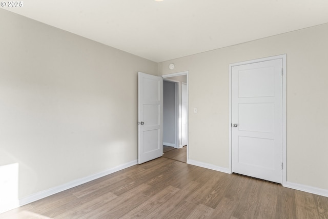 unfurnished bedroom with light wood-type flooring