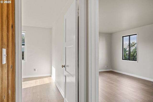 corridor featuring light hardwood / wood-style floors