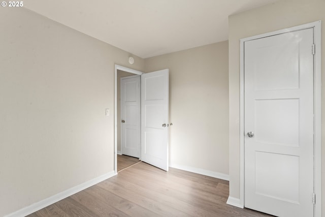 unfurnished bedroom featuring light hardwood / wood-style floors