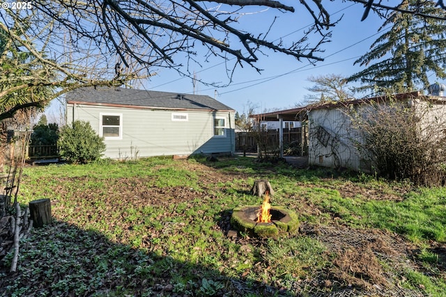 view of yard with an outdoor fire pit