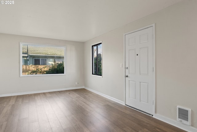 unfurnished room featuring wood-type flooring