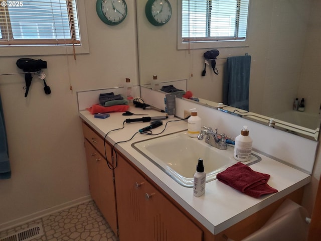 2640 Court Ave, Baker City, OR 97814 - full bath featuring plenty of natural light, vanity, and baseboards