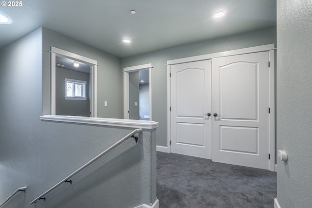 corridor with dark carpet