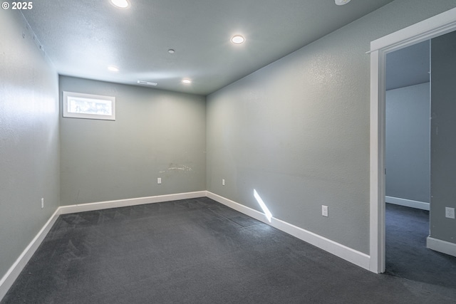 basement with dark carpet
