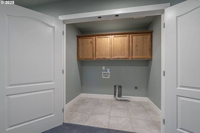 clothes washing area with cabinets, washer hookup, hookup for an electric dryer, and light tile patterned floors