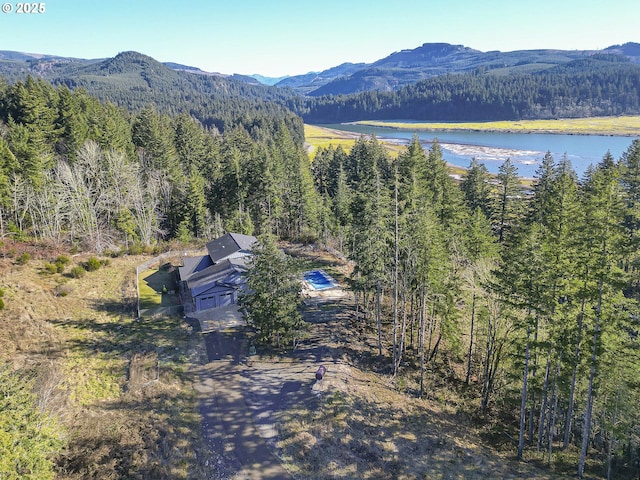 drone / aerial view featuring a water and mountain view