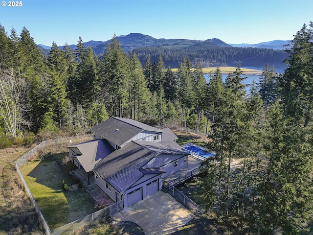 drone / aerial view featuring a water and mountain view