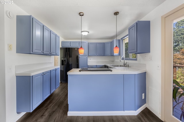 505/515 Empress Ave, Eugene, OR 97405 - kitchen with blue cabinets, black appliances, dark wood-type flooring, a peninsula, and pendant lighting