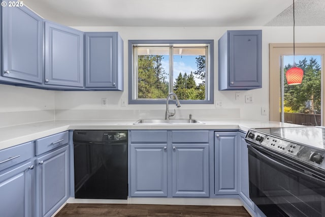 505/515 Empress Ave, Eugene, OR 97405 - kitchen with black dishwasher, range with electric cooktop, blue cabinetry, and light countertops