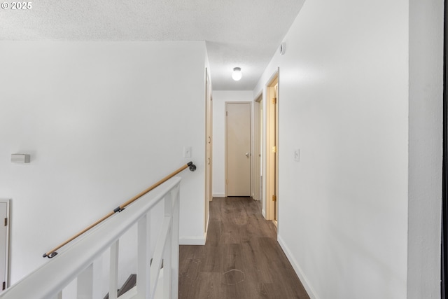 505/515 Empress Ave, Eugene, OR 97405 - hall featuring an upstairs landing, dark wood-type flooring, and a textured ceiling