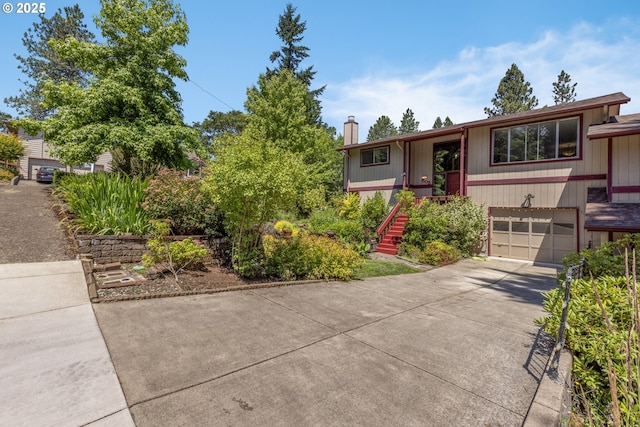 505/515 Empress Ave, Eugene, OR 97405 - raised ranch with a chimney, a garage, driveway, and stairs
