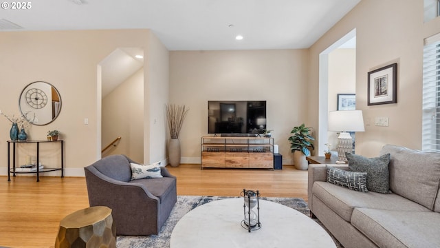 living area with visible vents, recessed lighting, baseboards, and wood finished floors