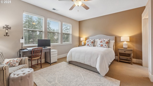 bedroom featuring baseboards, ceiling fan, light colored carpet, and visible vents