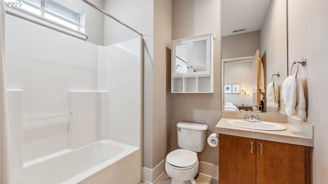 bathroom with visible vents, shower / tub combination, vanity, baseboards, and toilet