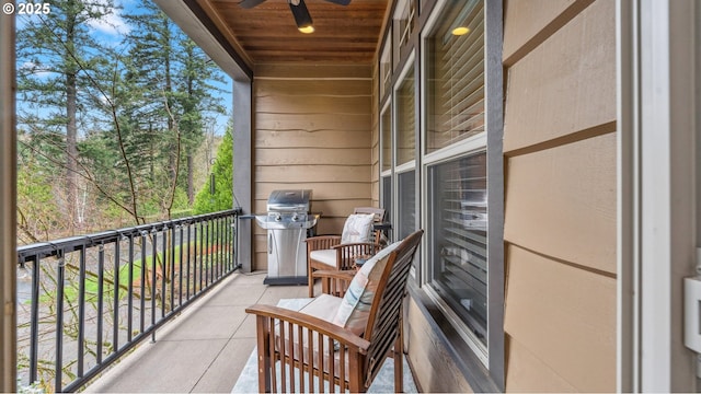 balcony featuring a ceiling fan and a grill