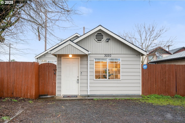 view of front of property with a gate and fence