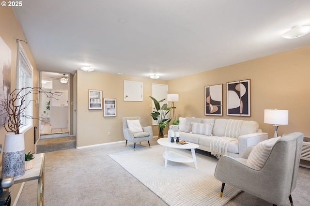 living area with carpet flooring and baseboards