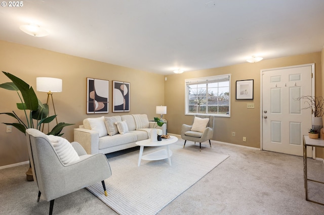 carpeted living area with baseboards