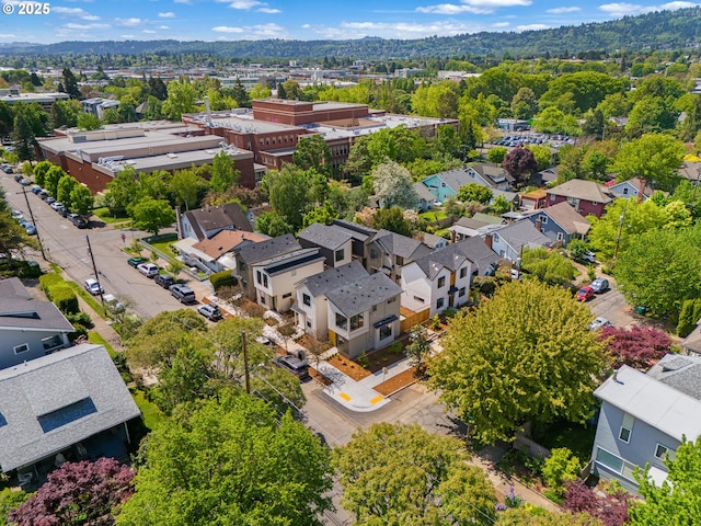 birds eye view of property with a residential view