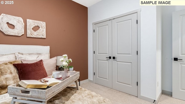 interior space with baseboards and light colored carpet