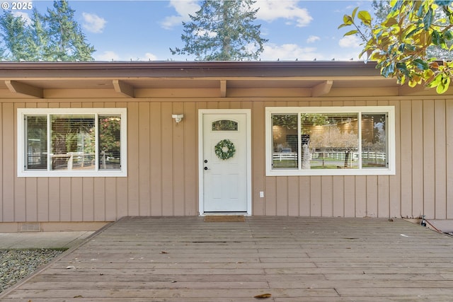 property entrance with a wooden deck