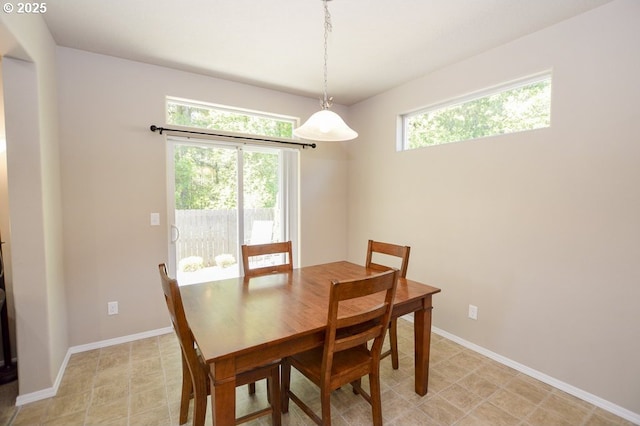 dining space featuring baseboards