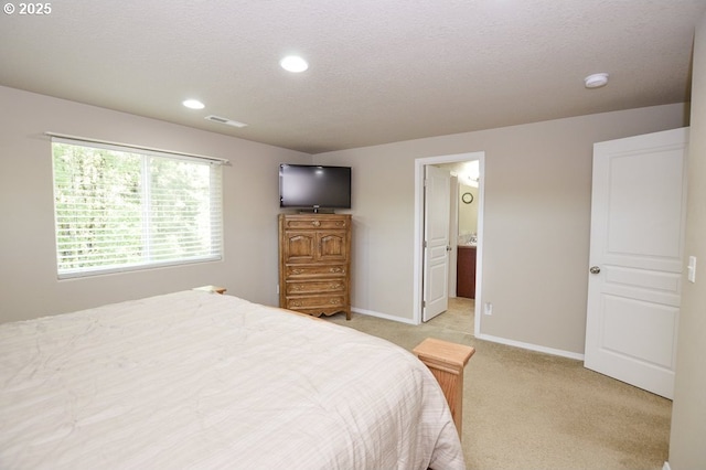 87743 Rendezvous Loop, Veneta, OR 97487 - bedroom with light colored carpet, baseboards, recessed lighting, and connected bathroom