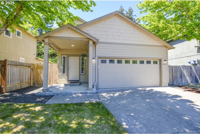 87743 Rendezvous Loop, Veneta, OR 97487 - view of front facade with concrete driveway and a garage