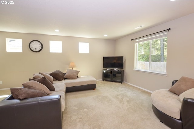 living room with baseboards, light carpet, and recessed lighting
