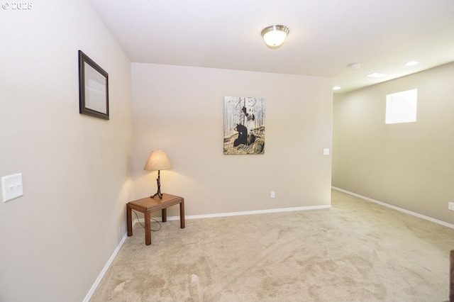 basement featuring carpet, baseboards, and recessed lighting