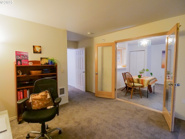 office space featuring visible vents, french doors, baseboards, and carpet