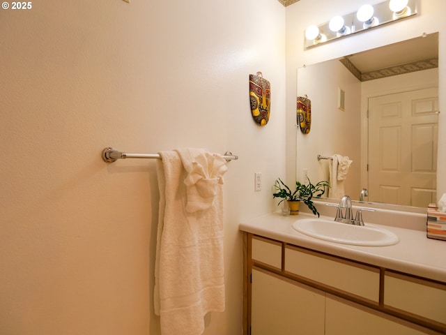 bathroom with vanity and visible vents