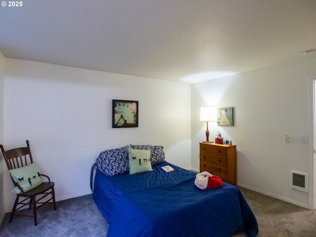 carpeted bedroom featuring visible vents and baseboards