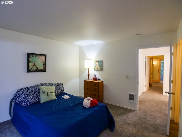 bedroom with visible vents, baseboards, and carpet flooring