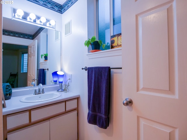 bathroom with visible vents and vanity