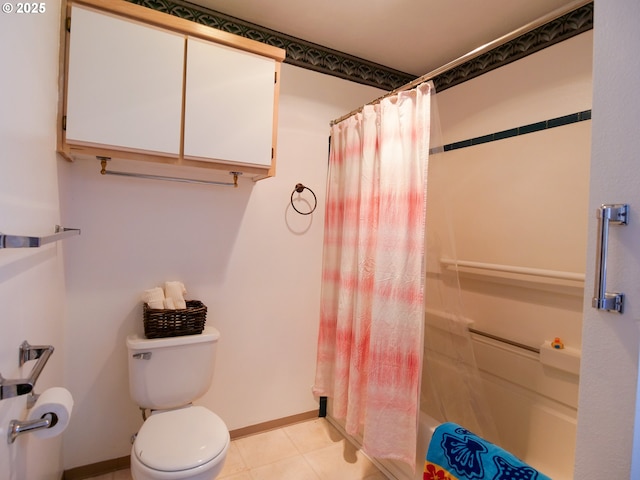 bathroom featuring shower / bath combination with curtain, toilet, and baseboards