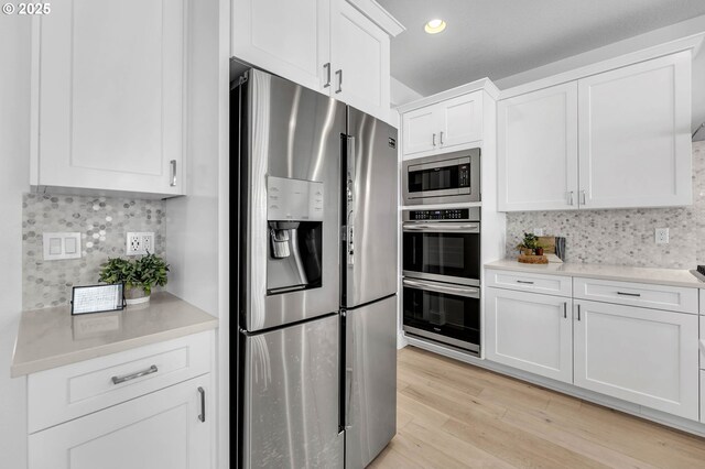 2928 S Harper Valley Way, Ridgefield, WA 98642 - kitchen featuring light countertops, decorative backsplash, and appliances with stainless steel finishes